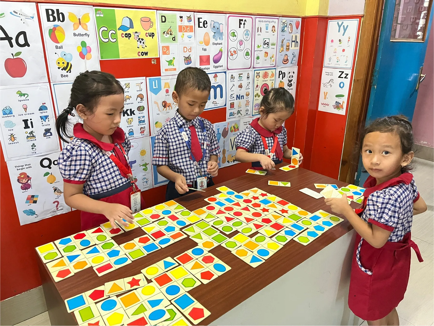 Children sorting colourful shapes